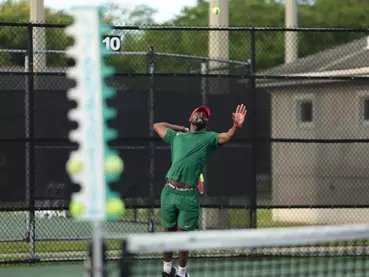 MVSU tennis player tossing to serve