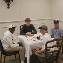 Golfers gathered at a V Club golf event