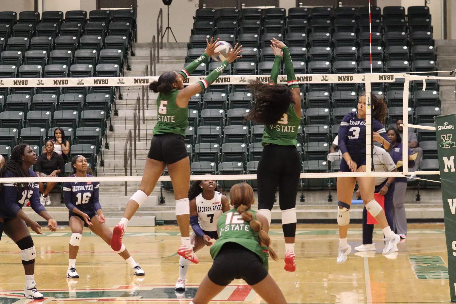 MVSU volleyball players going up for a block