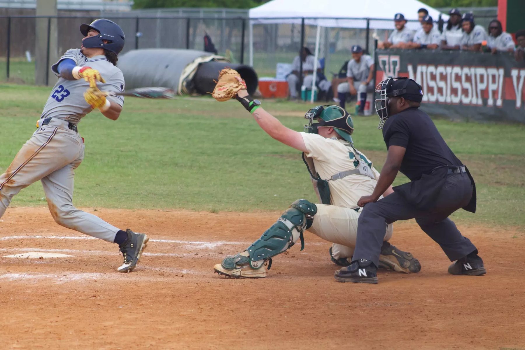 MVSU catcher and umpire at the plate during a play