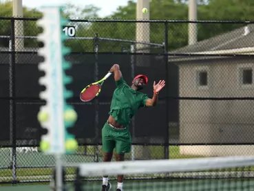 MVSU tennis player following through on a serve