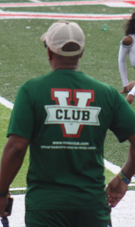 Supporter wearing a V Club shirt on the sideline