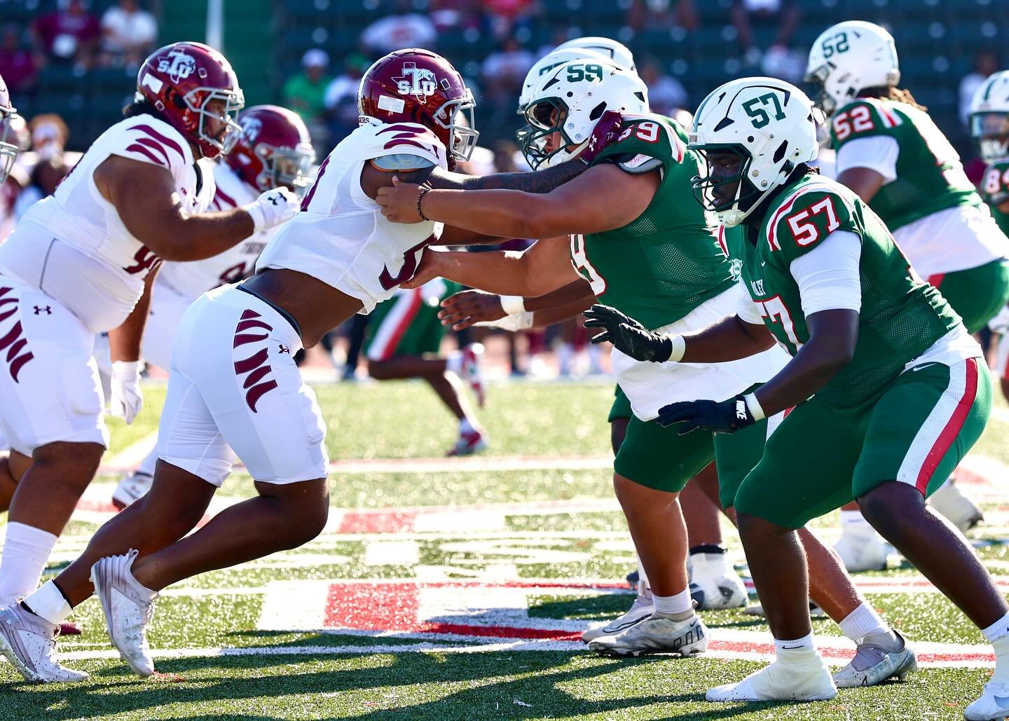 MVSU linemen engaging at the line of scrimmage
