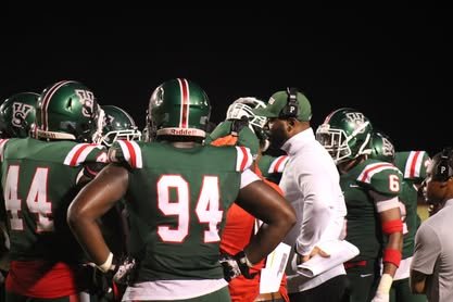 MVSU football huddle at night