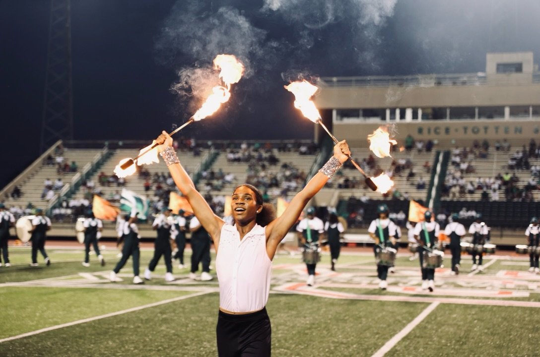 Fire twirler performing with the band on game day