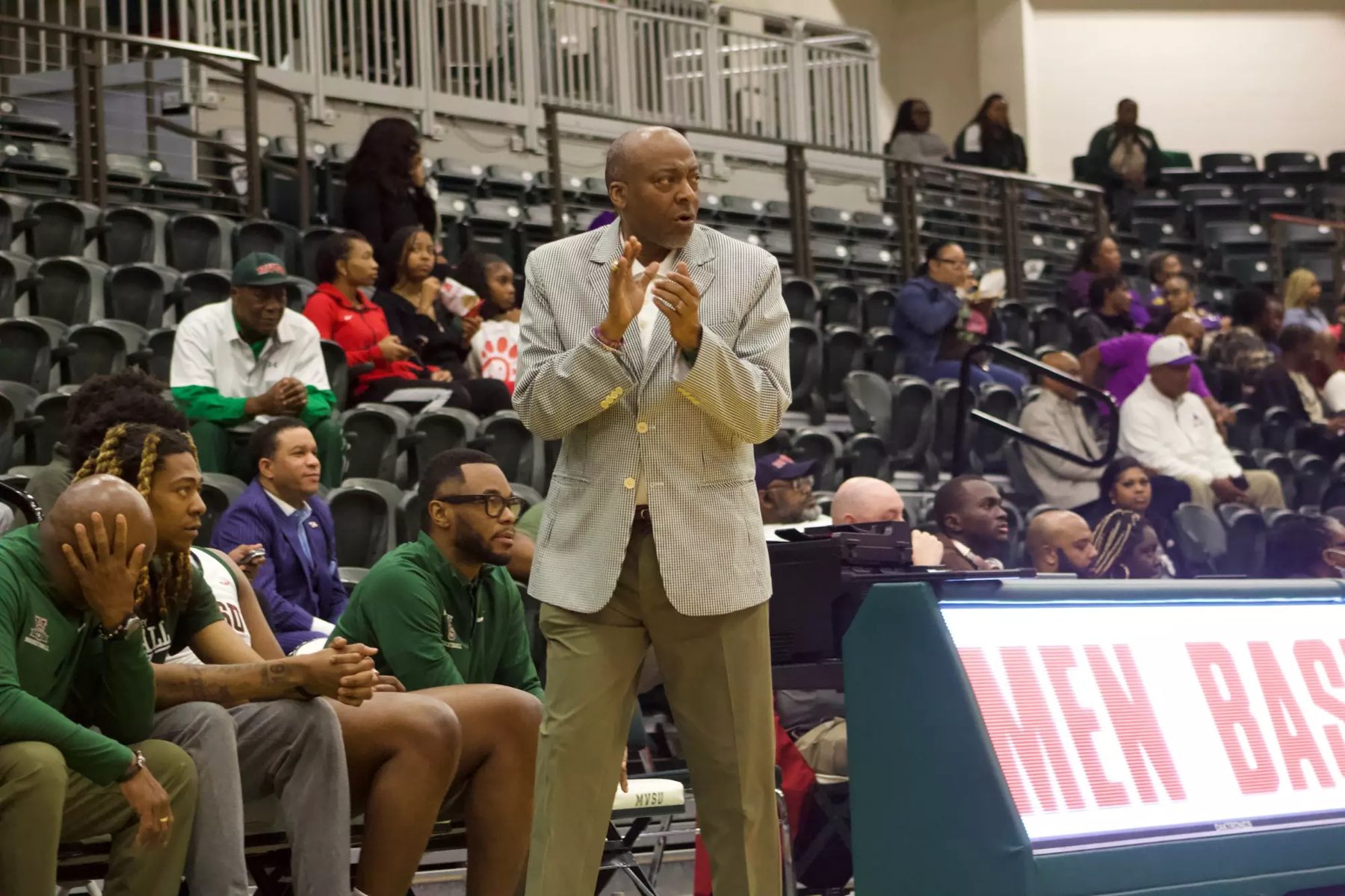 MVSU men's basketball bench and coach during a game