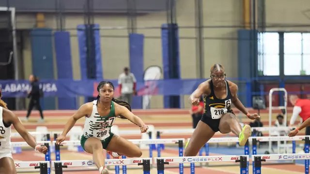 MVSU hurdler clearing a hurdle indoors